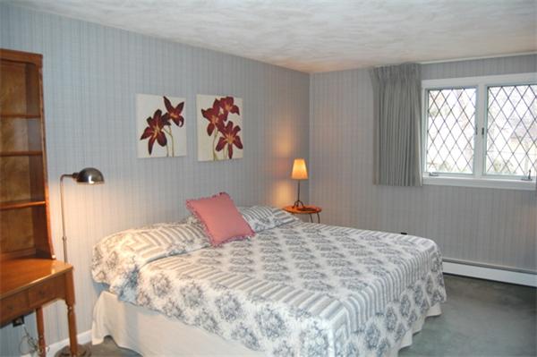 4 Dudley Road Lexington, MA 02421 - Photo 17 of 26 a bedroom with a bed and a window
