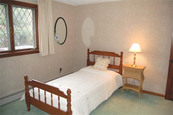 4 Dudley Road Lexington, MA 02421 - Photo 18 of 26 a bedroom with a bed a table and windows