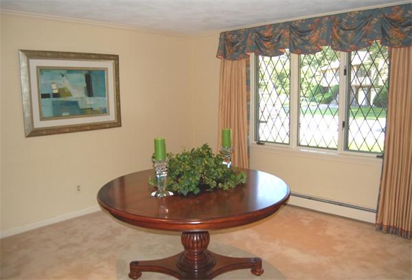 4 Dudley Road Lexington, MA 02421 - Photo 2 of 26 a room with a large window and a potted plant