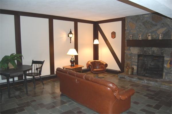 4 Dudley Road Lexington, MA 02421 - Photo 21 of 26 a living room with furniture and a large window
