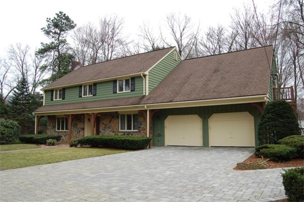 4 Dudley Road Lexington, MA 02421 - Photo 26 of 26 a front view of a house with a yard and garage
