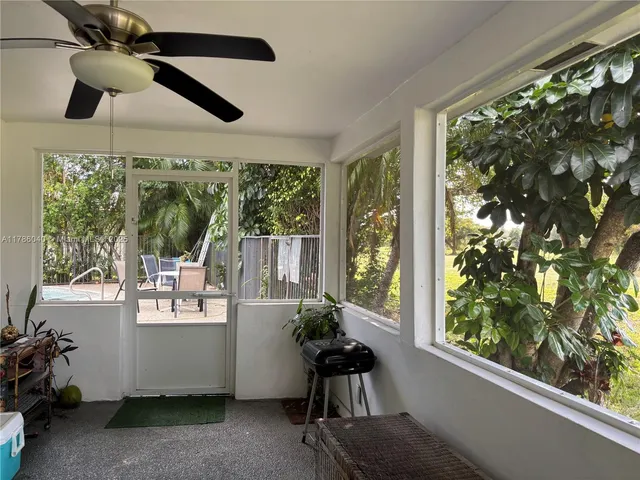 a room with furniture and a large window