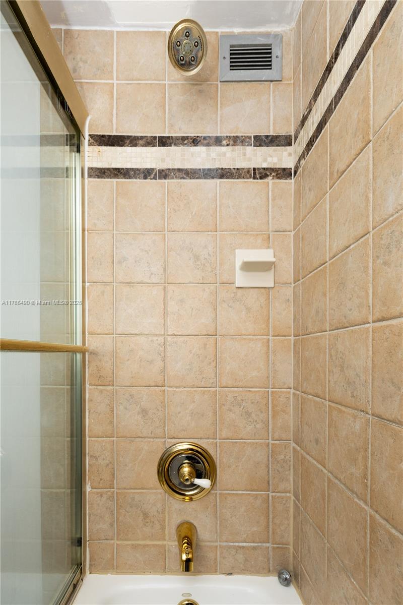 2750 Northeast 183rd Street, Unit 511 Aventura, FL 33160 - Photo 13 of 36 a bathroom with a shower