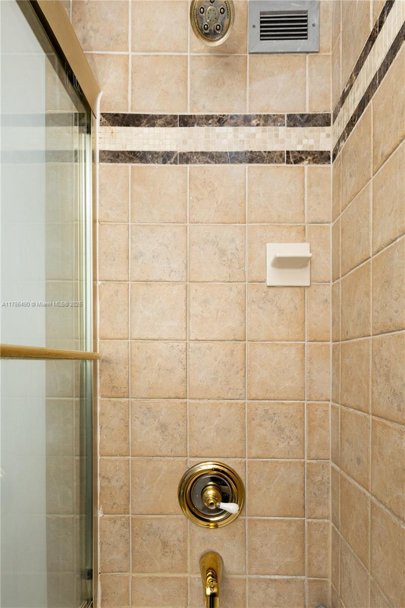 2750 Northeast 183rd Street, Unit 511 Aventura, FL 33160 - Photo 14 of 36 a bathroom with a shower