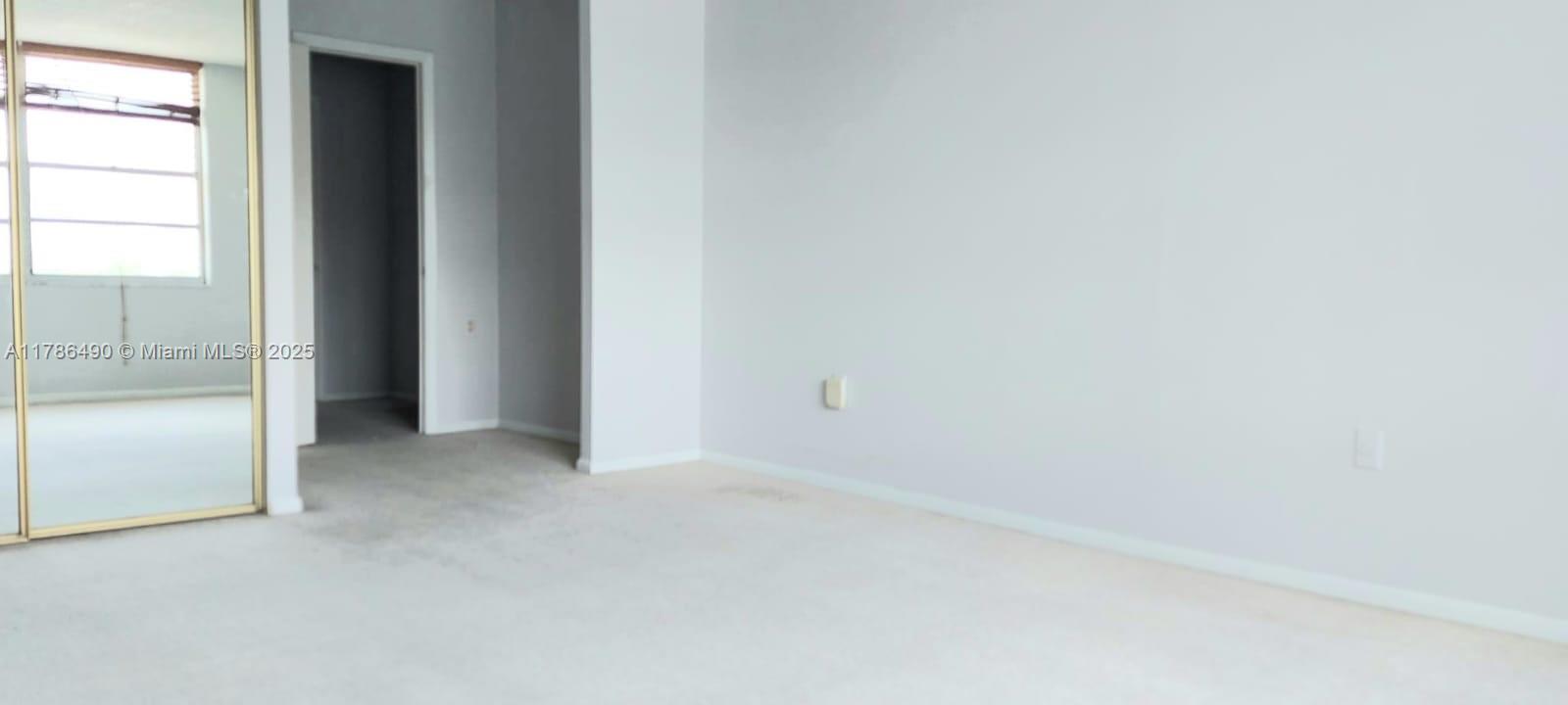 2750 Northeast 183rd Street, Unit 511 Aventura, FL 33160 - Photo 15 of 36 an empty room with windows