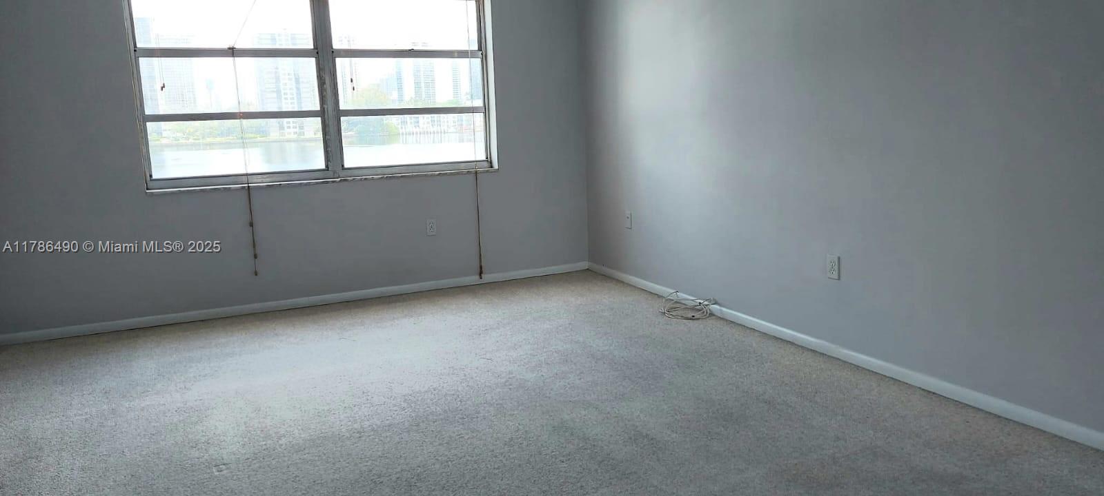 2750 Northeast 183rd Street, Unit 511 Aventura, FL 33160 - Photo 18 of 36 an empty room with a empty space and window