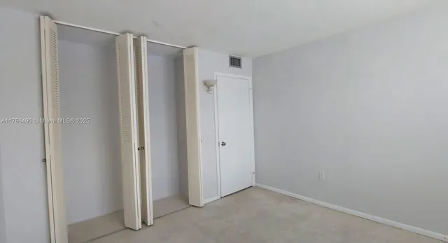 a view of a room with drop ceiling