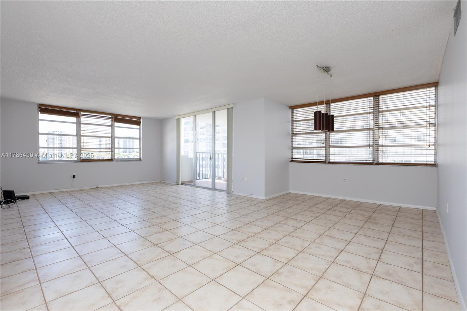 2750 Northeast 183rd Street, Unit 511 Aventura, FL 33160 - Photo 24 of 36 an empty room with windows