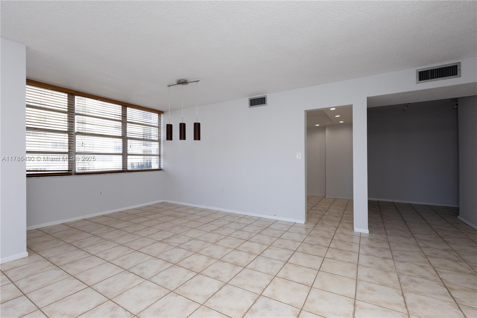 2750 Northeast 183rd Street, Unit 511 Aventura, FL 33160 - Photo 26 of 36 an empty room with windows