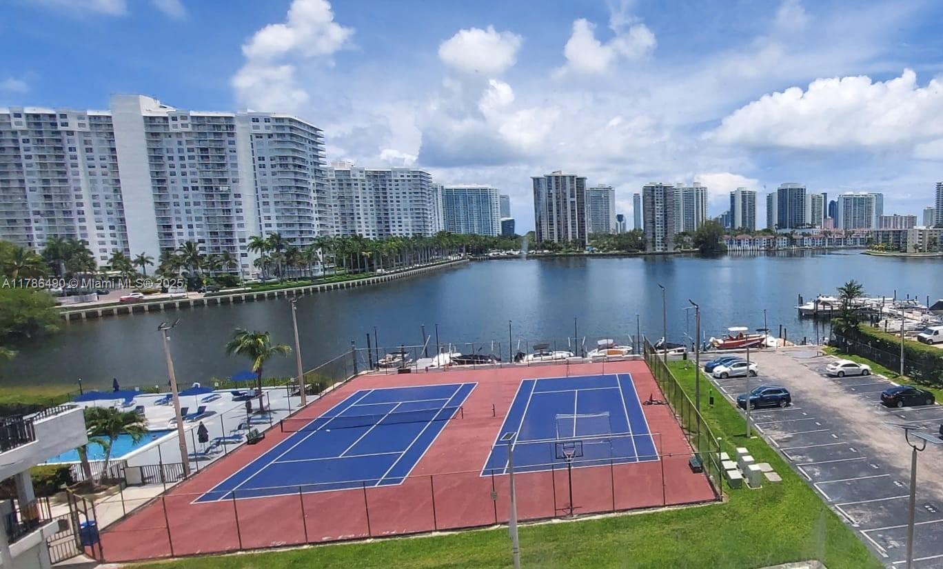 2750 Northeast 183rd Street, Unit 511 Aventura, FL 33160 - Photo 31 of 36 a view of a lake with tall building