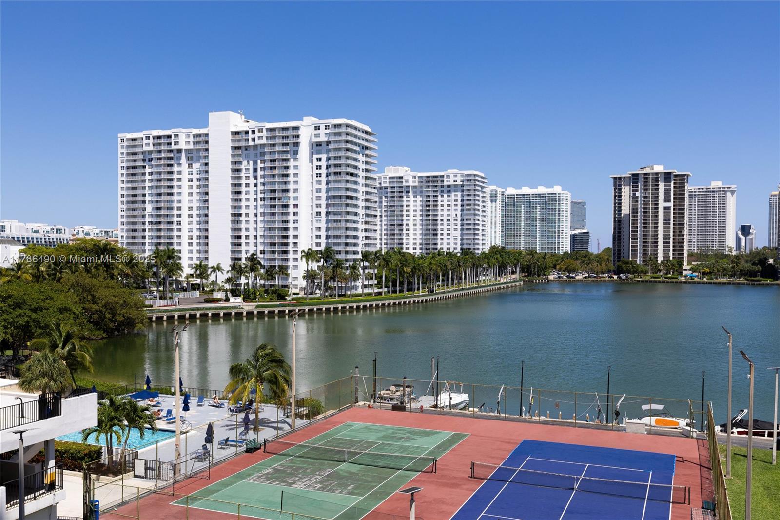 2750 Northeast 183rd Street, Unit 511 Aventura, FL 33160 - Photo 32 of 36 a view of a lake with tall building