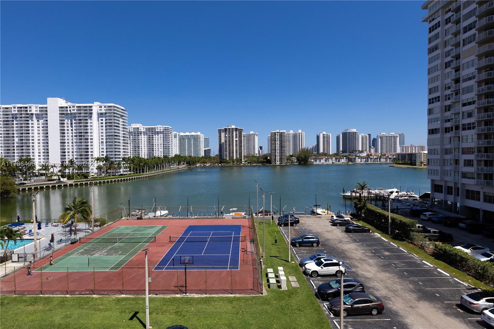 2750 Northeast 183rd Street, Unit 511 Aventura, FL 33160 - Photo 33 of 36 a view of a lake with a city