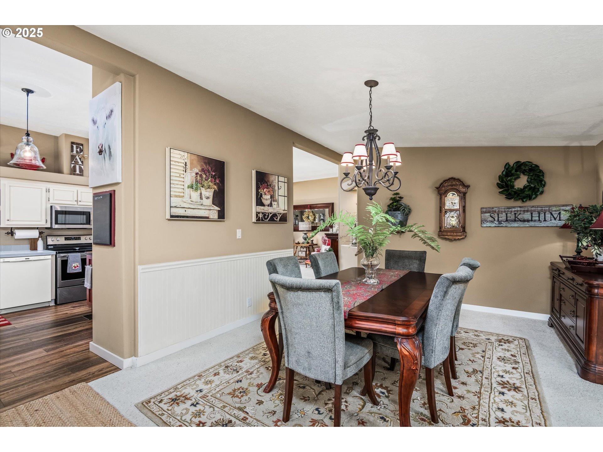 3220 Crescent Avenue, Unit 34 Eugene, OR 97408 - Photo 17 of 38 a view of a dining room with furniture and chandelier