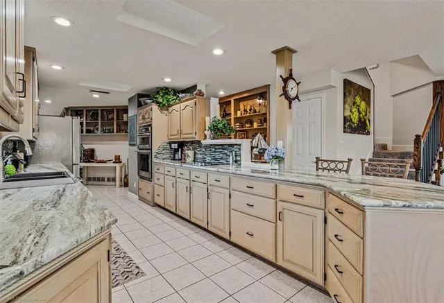 a large kitchen with cabinets