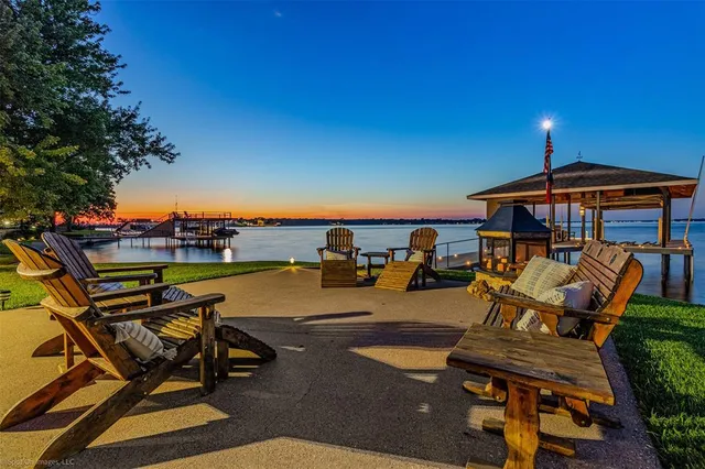 a view of a swimming pool with lounge chairs