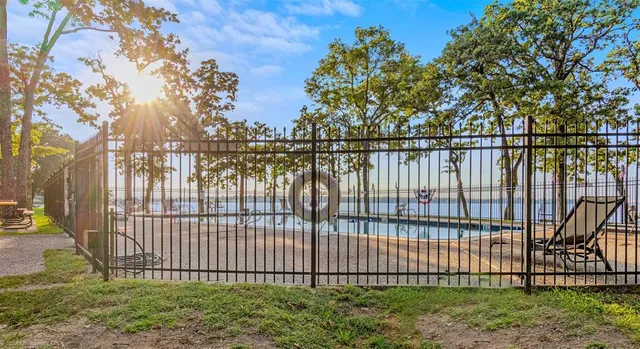 a view of outdoor space with iron fence