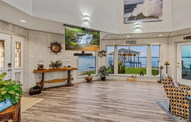 a living room with furniture and wooden floor