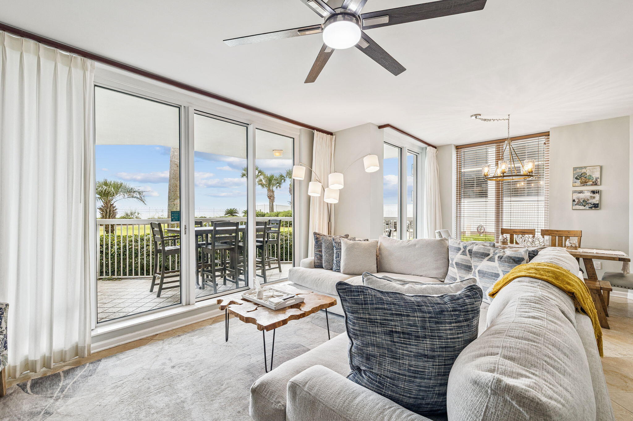 1048 Highway 98, Unit 106W Destin, FL 32541 - Photo 12 of 37 a living room with furniture and a large window