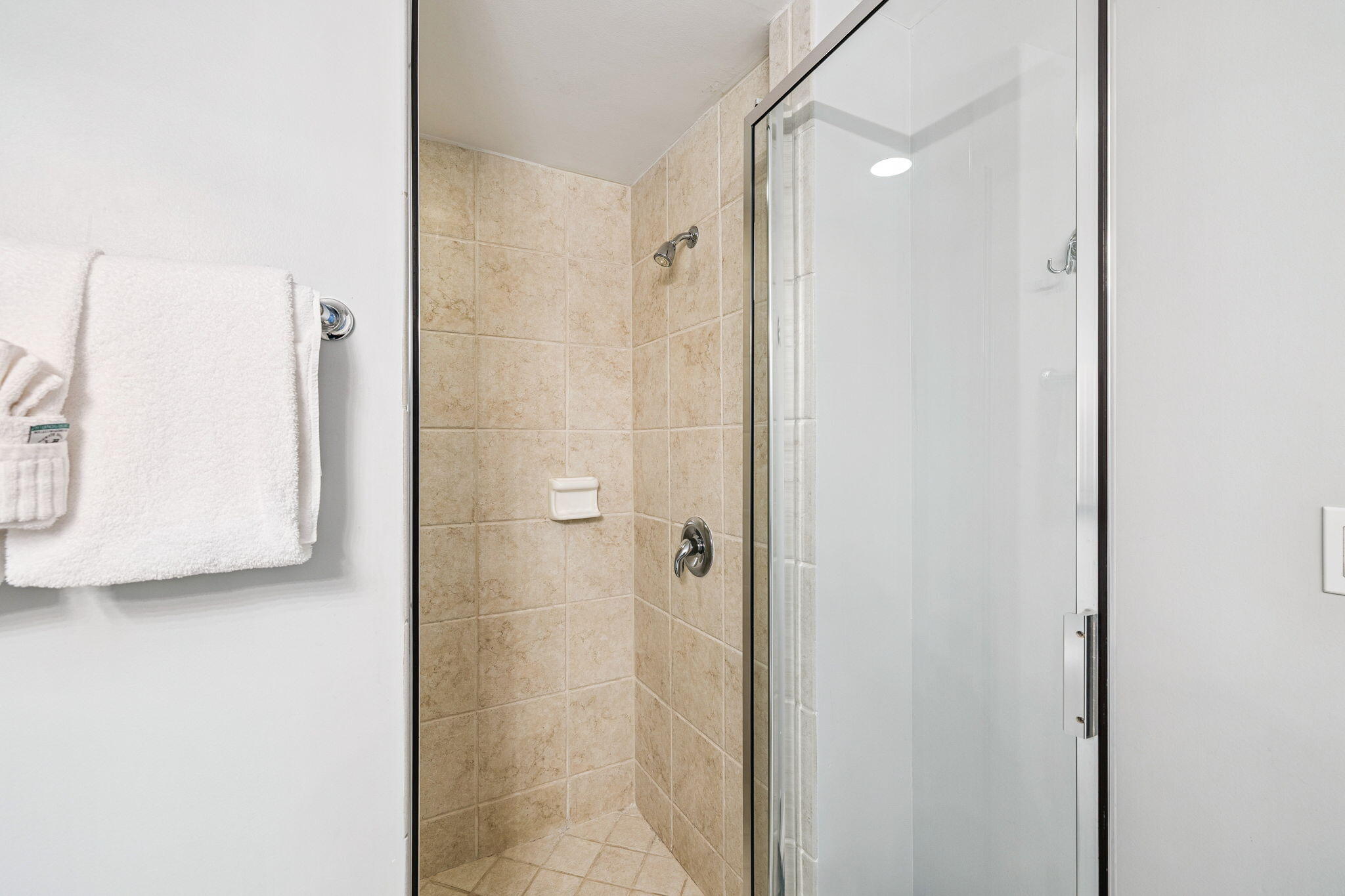 1048 Highway 98, Unit 106W Destin, FL 32541 - Photo 22 of 37 a bathroom with a shower and a mirror
