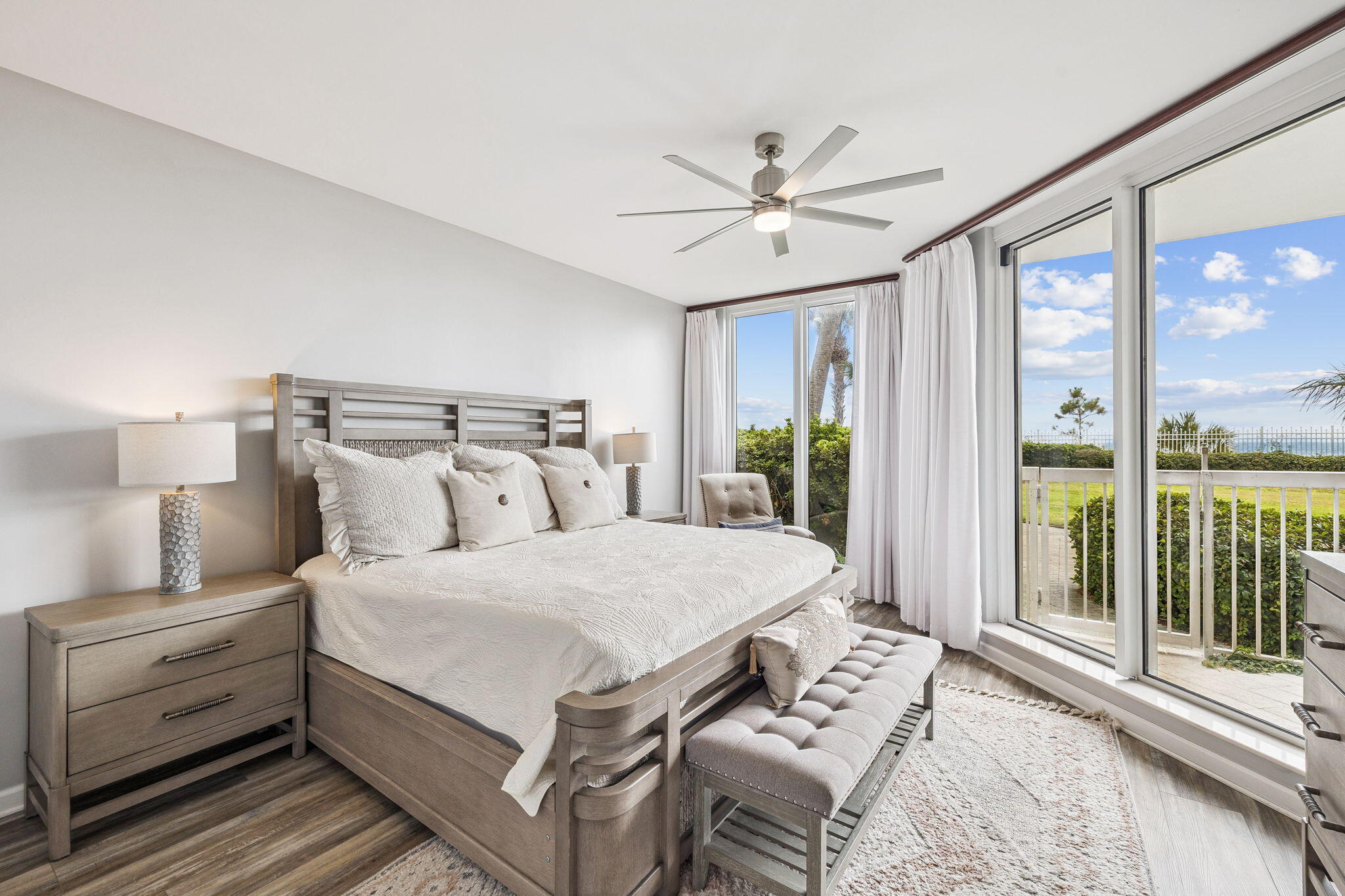 1048 Highway 98, Unit 106W Destin, FL 32541 - Photo 4 of 37 a bedroom with a large bed and a window