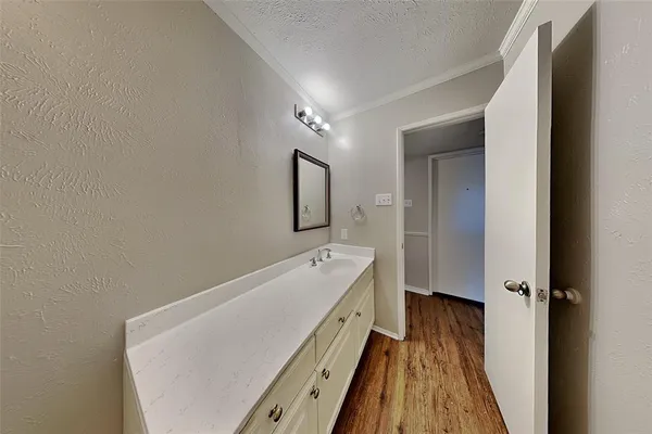 a spacious bathroom with a bathtub and a sink