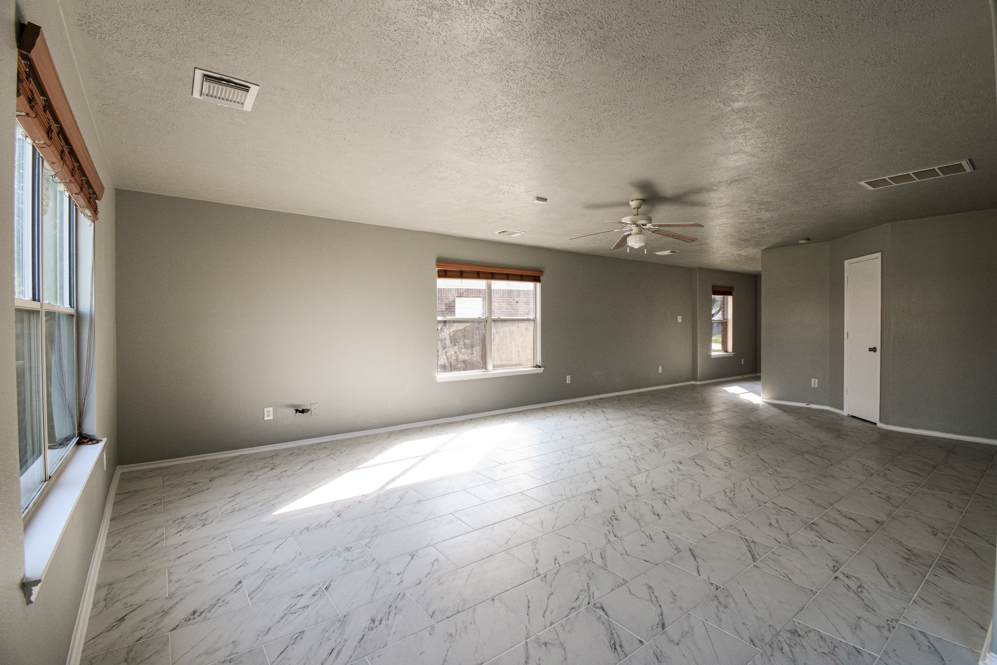 19362 Moss Meadow Lane Katy, TX 77449 - Photo 12 of 35 an empty room with windows and entrance