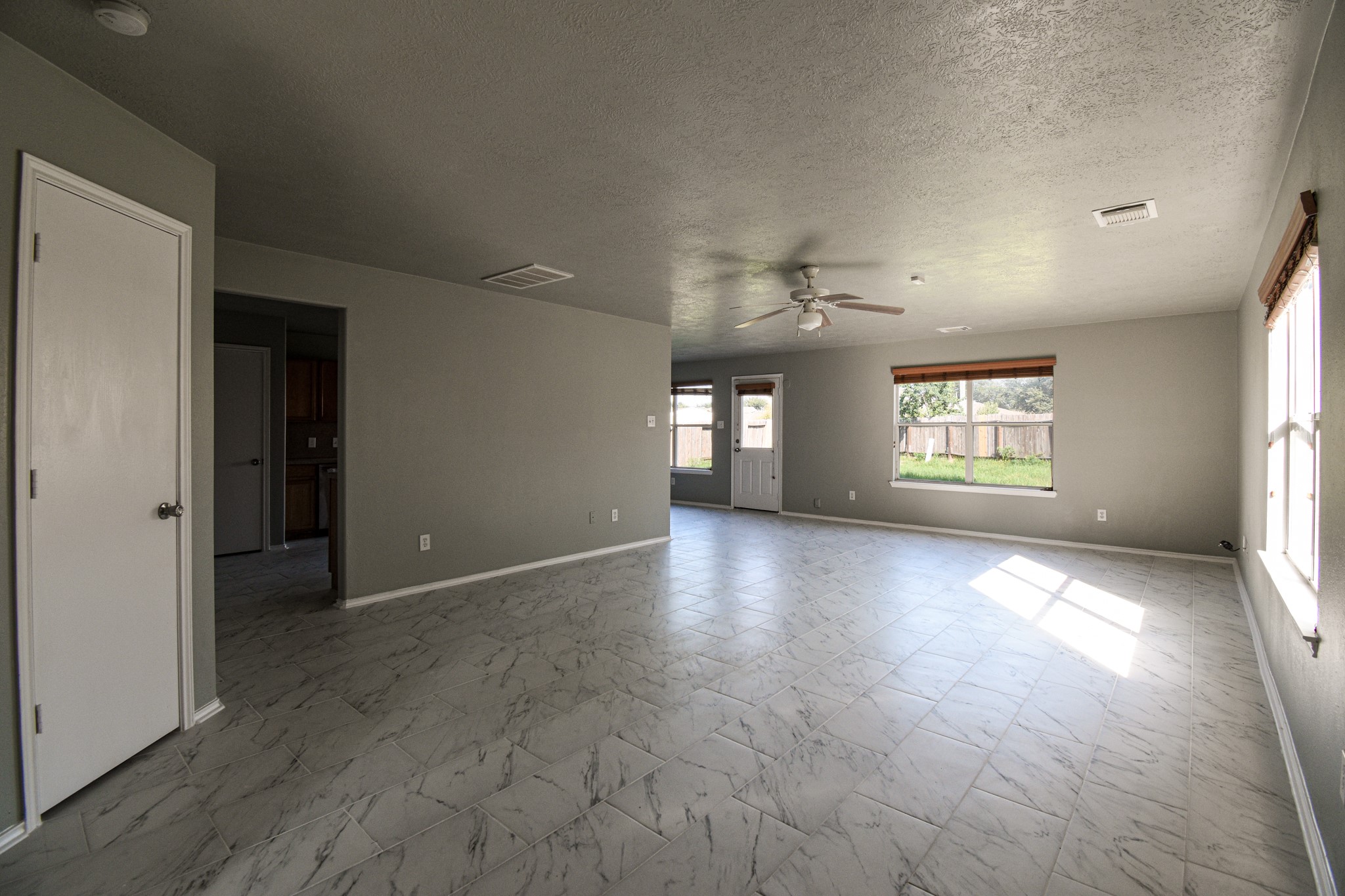 19362 Moss Meadow Lane Katy, TX 77449 - Photo 14 of 35 an empty room with windows and entrance