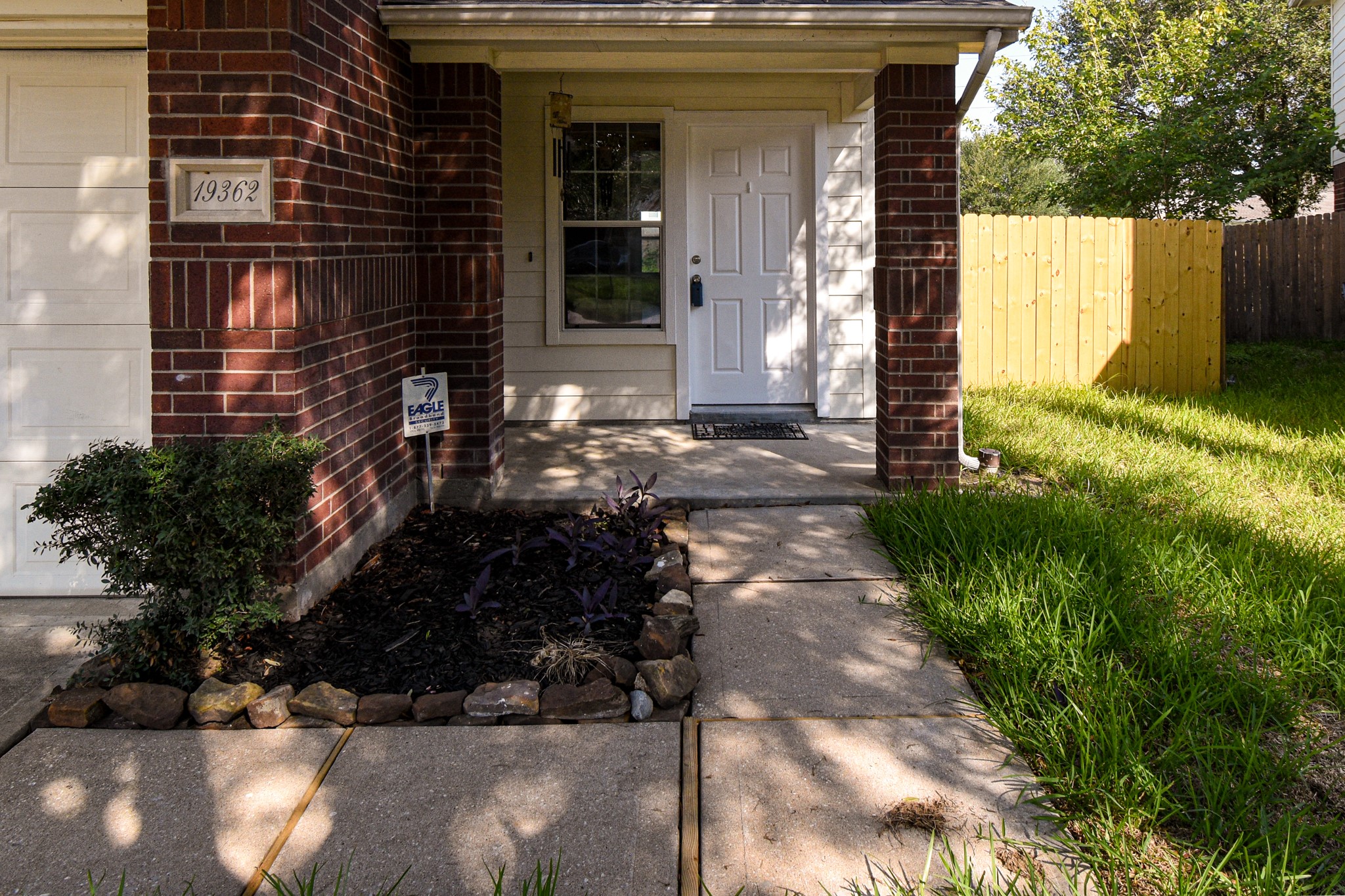 19362 Moss Meadow Lane Katy, TX 77449 - Photo 2 of 35 a view of a pathway of a house with a yard