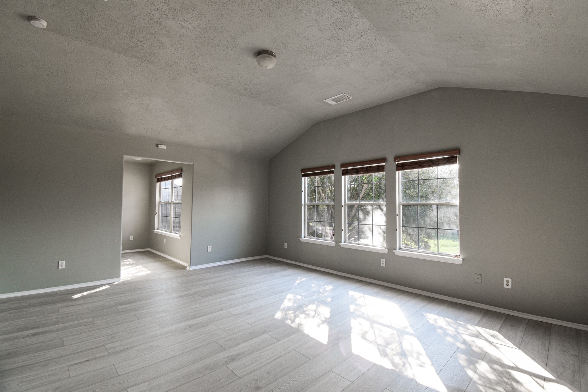 19362 Moss Meadow Lane Katy, TX 77449 - Photo 27 of 35 a view of an empty room with wooden floor and a window