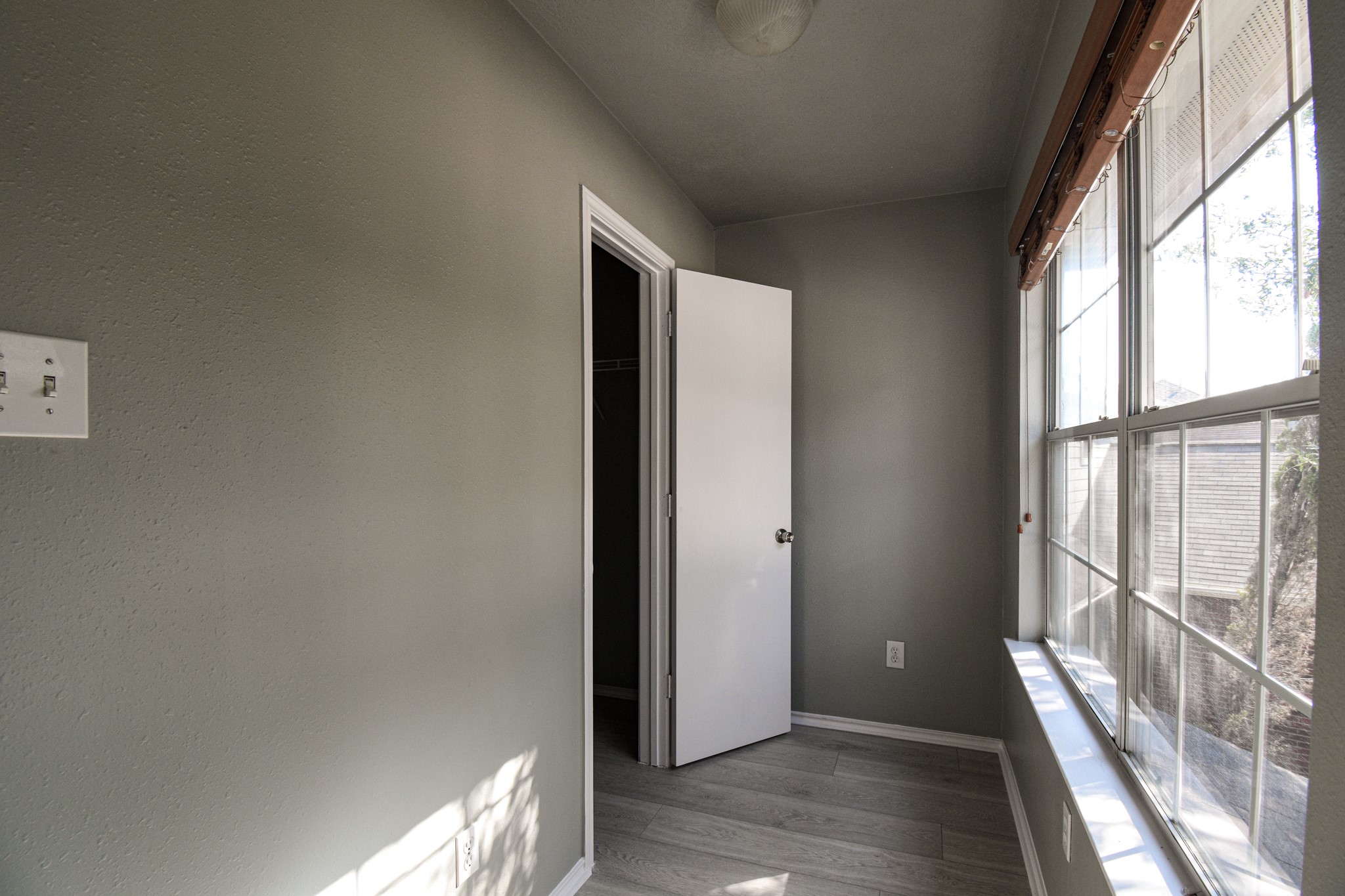 19362 Moss Meadow Lane Katy, TX 77449 - Photo 29 of 35 an empty room with wooden floor and windows