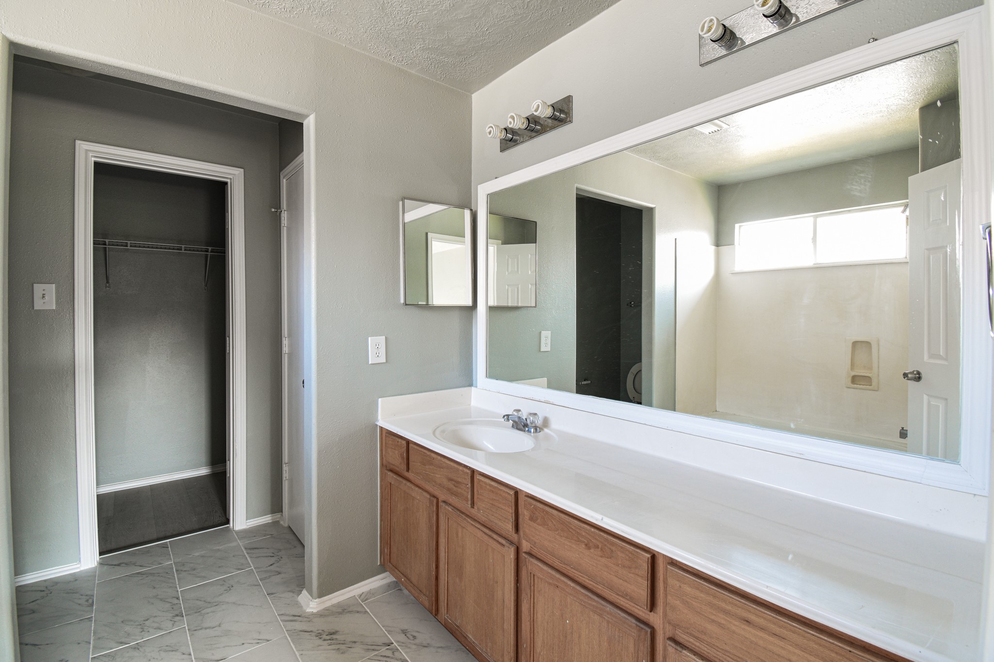 19362 Moss Meadow Lane Katy, TX 77449 - Photo 31 of 35 a bathroom with a sink and a mirror