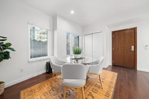 a dining room with furniture window wooden floor