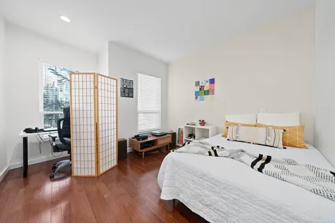 a bedroom with a bed and a couch