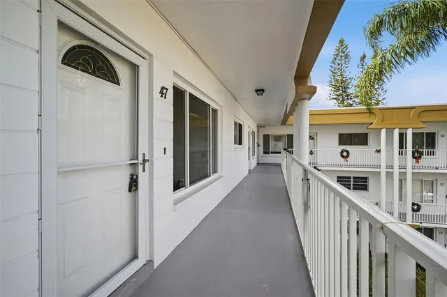 a view of a house with deck and entrance