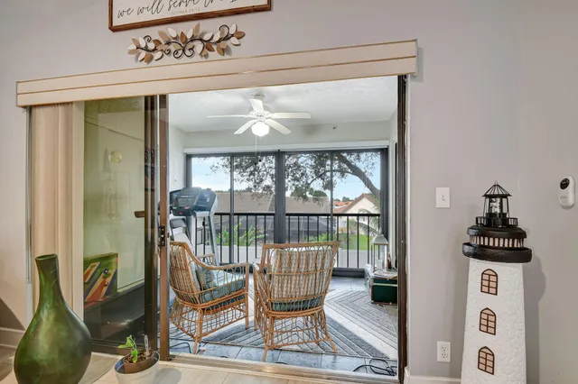a bedroom with a bed and a flat tv screen on dresser