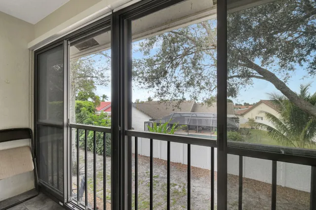 a view of walk in closet with clothes