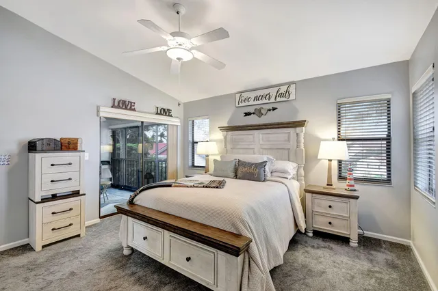 a bedroom with a bed and a television