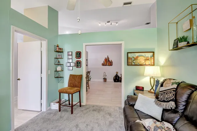 an aerial view of residential houses with outdoor space and river