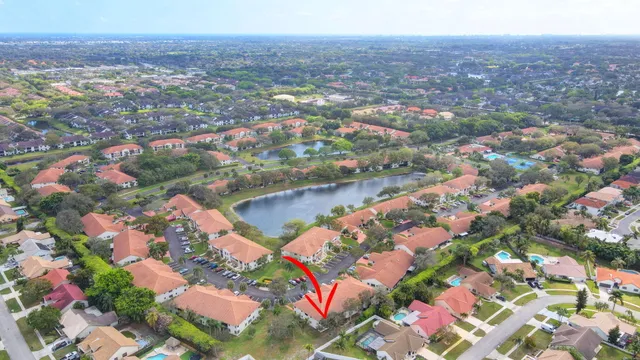 a dining hall with stainless steel appliances a dining table and chairs