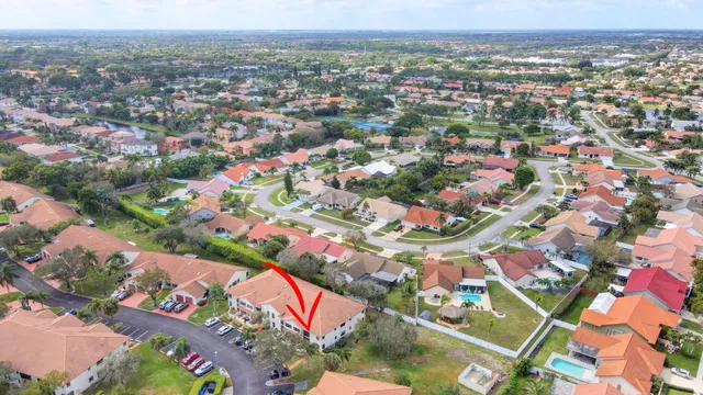 a dining room with furniture and a flat screen tv