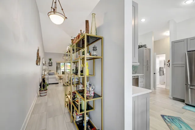 a kitchen with stainless steel appliances a refrigerator and a sink