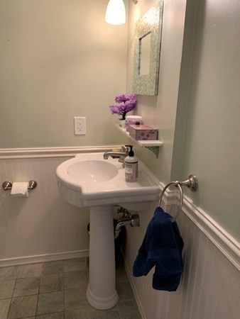 110 Maple Place, Unit 7 Dedham, MA 02026 - Photo 11 of 17 a bathroom with a sink and a mirror