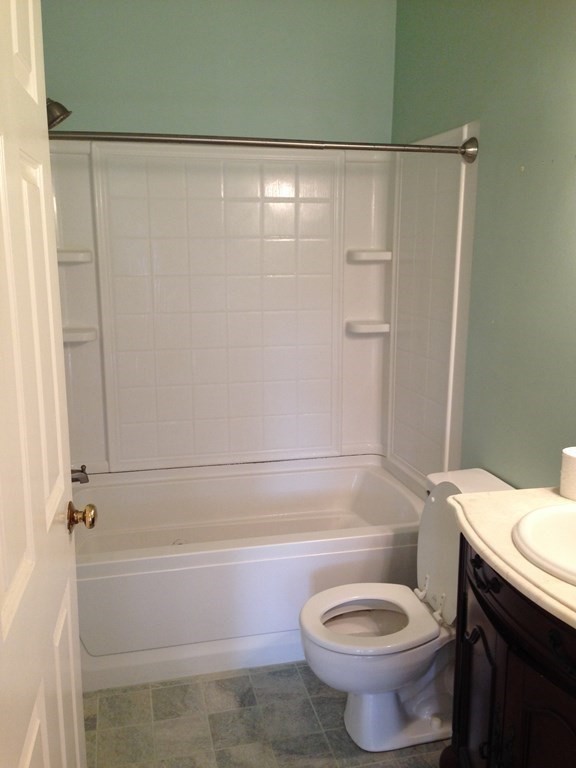 110 Maple Place, Unit 7 Dedham, MA 02026 - Photo 15 of 17 a bathroom with a toilet and a shower
