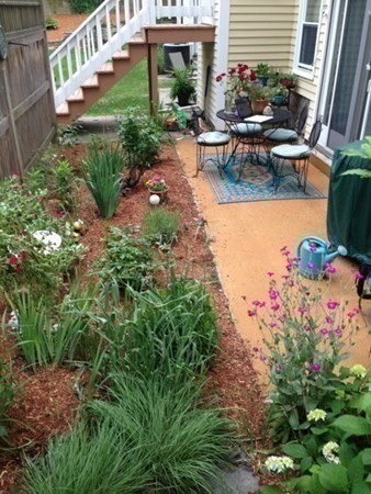 110 Maple Place, Unit 7 Dedham, MA 02026 - Photo 17 of 17 a view of a house with backyard and sitting area
