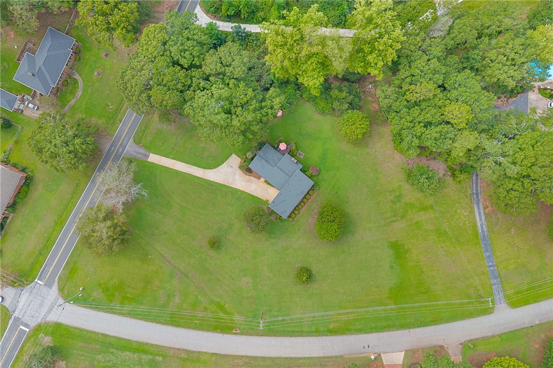 131 Bowen Road Anderson, SC 29621 - Photo 36 of 36 Mature trees frame a vast grassy lot surrounding the home on a peaceful corner bend.