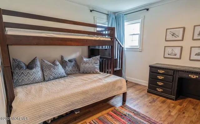a bedroom with a bed and cabinets