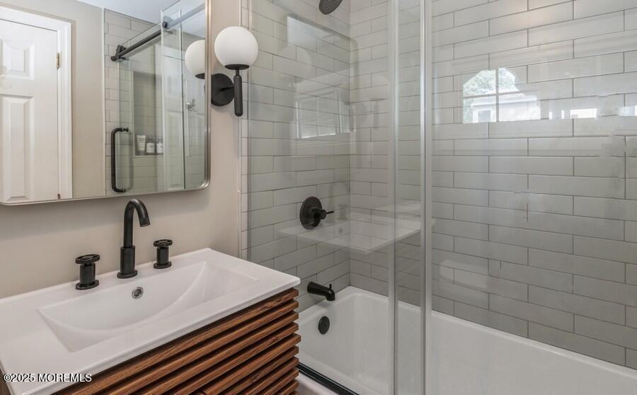 24 Layton Avenue Pine Beach, NJ 08741 - Photo 19 of 25 a bathroom with a sink a toilet and shower