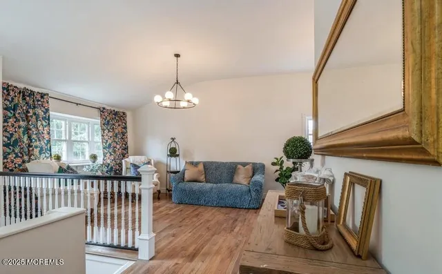 a living room with furniture a window and a dining table