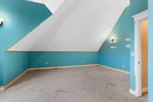 a view of a hallway with a white walls and stairs