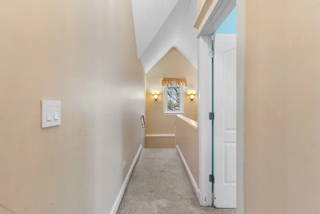 a view of an empty room with wooden walls